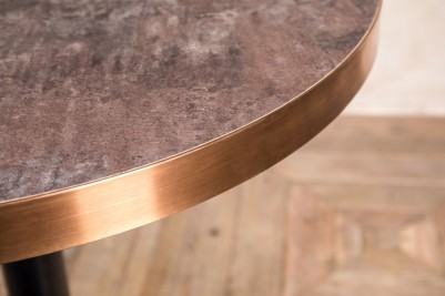 aged brass edged circle dining table